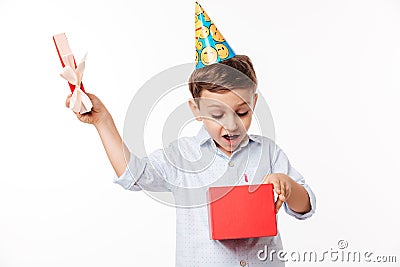 Portrait of an excited cute little kid in a birthday hat Stock Photo