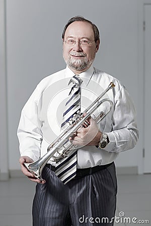 Portrait.experienced teacher of music with a trumpet Stock Photo