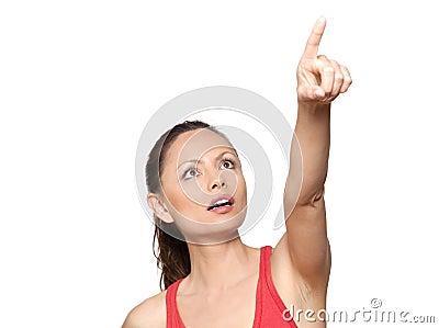 Portrait of expressive surprised woman pointing up Stock Photo