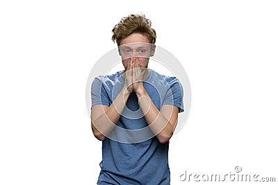 Portrait of extremely sad teenager isolated on white. Stock Photo