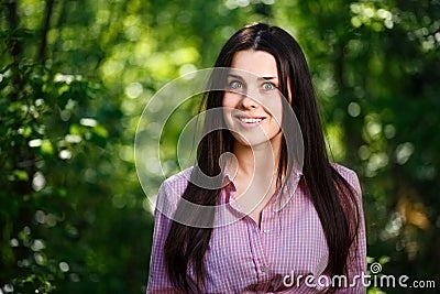 Portrait of extremely surprised, amazed, happy woman with emotiv Stock Photo