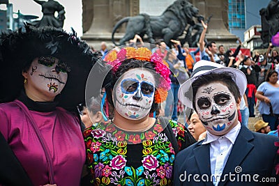 Mexico City, Mexico, ; October 26 2016: Portrait of a family in disguise at the Day of the Dead parade in Mexico City Editorial Stock Photo