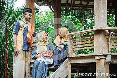 family muslim sitting in the garden and having a conversation Stock Photo