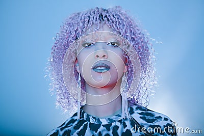 Fashion black woman with elegant earrings and sensual blue lips Stock Photo