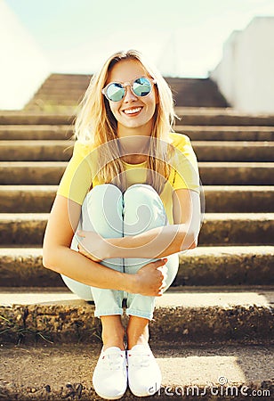 Portrait fashion pretty smiling woman wearing a sunglasses Stock Photo