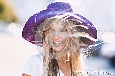 Portrait of Fashion stylish of young hipster blonde woman, elegant lady, bright colors dress, cool girl. City view urban l Stock Photo