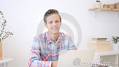 Portrait of a fashionable young professional man in a stylish creative office Stock Photo