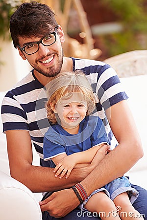 Portrait Of Father And Son Playing Outside Together Stock Photo