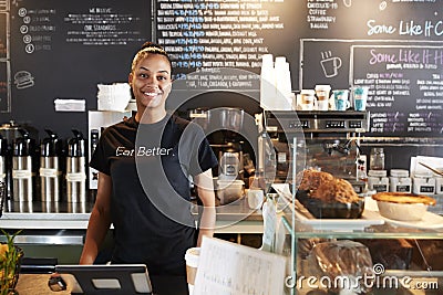 Portrait Of Female Barista Behind Counter In Coffee Shop Editorial Stock Photo