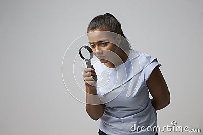 Portrait Of Female Criminologist With Magnifying Glass Stock Photo