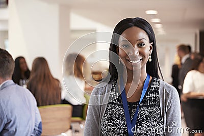 Portrait Of Female Delegate During Break At Conference Stock Photo