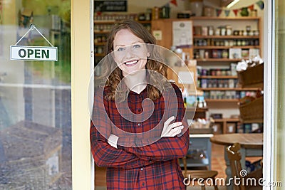 Portrait Of Female Delicatessen Owner Outside Store Stock Photo