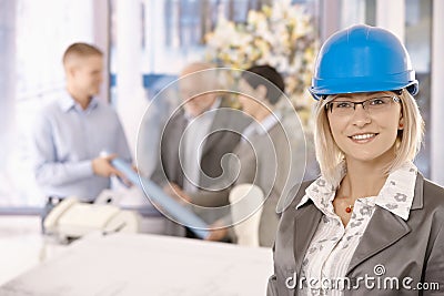 Portrait of female designer in hardhat Stock Photo