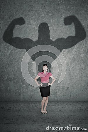 Female entrepreneur with her strong shadow Stock Photo