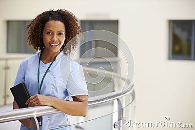 Portrait Of Female Nurse With Digital Tablet In Hospital Stock Photo