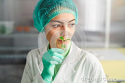 Female Worker at Food Factory Stock Photo