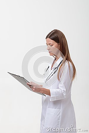 fimale medical doctor holding a folder isolated on white Stock Photo