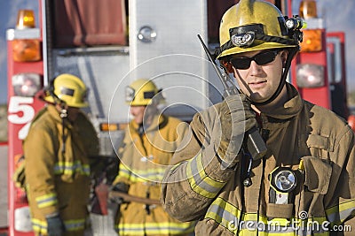 Portrait Of A Firefighter Talking On Radio Stock Photo
