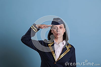 Portrait of flight attendant doing aviation honour salut Stock Photo