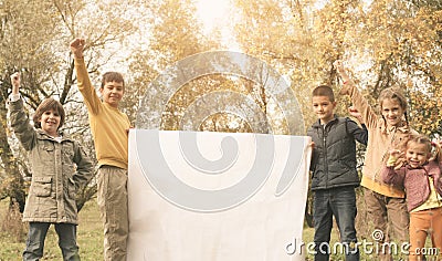 Portrait of four children in the park. Happy kids enjoying in a Stock Photo