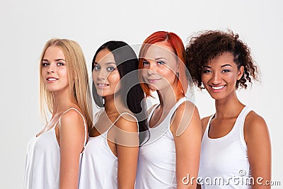 Portrait of a four smiling multi ethnic women Stock Photo