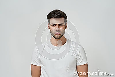 Portrait of frowning angry bearded man Stock Photo