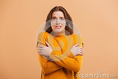 Portrait of a frozen young woman in sweater Stock Photo