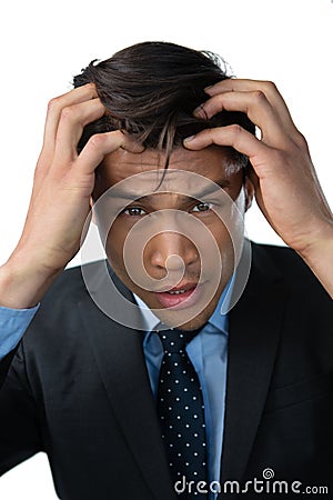 Portrait of frustrated businessman with head in hand Stock Photo