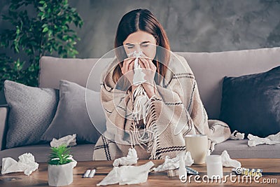 Portrait of frustrated girl sit divan stay home she sick corona virus sneezing handkerchief cover close checkered plaid Stock Photo