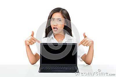 frustrated emotional woman pointing fingers at laptop Stock Photo