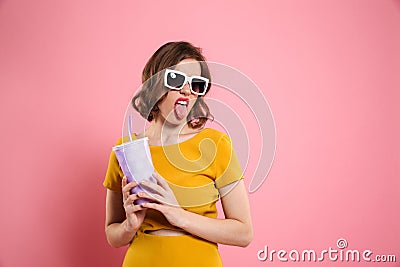 Portrait of a funnny girl in sunglasses holding cup Stock Photo