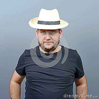 Portrait of funny chubby man wearing straw hat Stock Photo