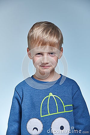 Portrait of a funny emotional and cunning boy Stock Photo