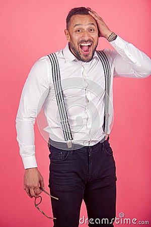 Portrait of funny funky crazy man. Freak guy. Amazed brunet male hears surprised news, wonders about something, dressed Stock Photo