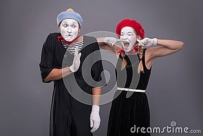 Portrait of funny mime couple with white faces and Stock Photo