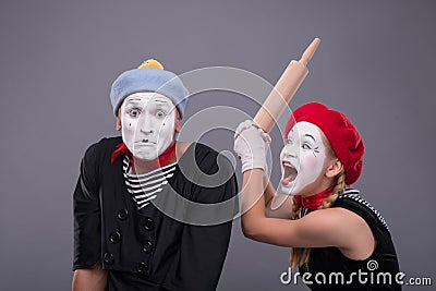 Portrait of funny mime couple with white faces and Stock Photo