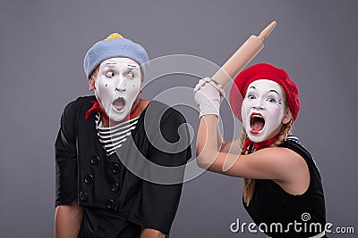 Portrait of funny mime couple with white faces and Stock Photo