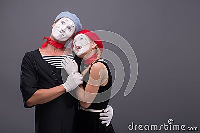 Portrait of funny mime couple with white faces and Stock Photo