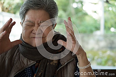 Portrait of furious elder woman, enraged elderly female, angry s Stock Photo