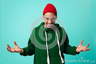 Portrait of a furious young afro american man in hat Stock Photo