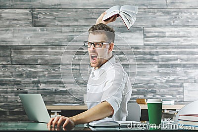 Furious male at workplace Stock Photo