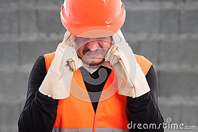 Portrait of fustrated workman with headache Stock Photo