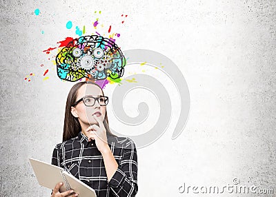 Portrait of a geek girl in glasses and brain cogs Stock Photo