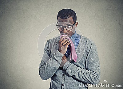 Portrait geeky nervous anxious man bitting chewing his tie Stock Photo