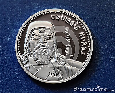 The portrait of genghis khan on a mongolian silver coin Stock Photo