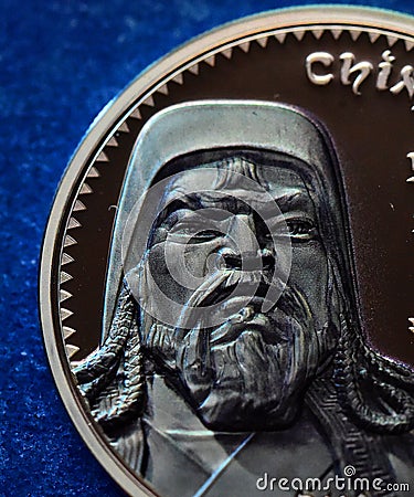 The portrait of genghis khan on a mongolian silver coin Stock Photo