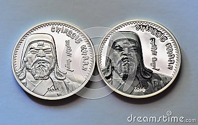 The portrait of genghis khan on a mongolian silver coin Stock Photo