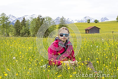 Portrait of a girl against the panorama of the Alps Stock Photo