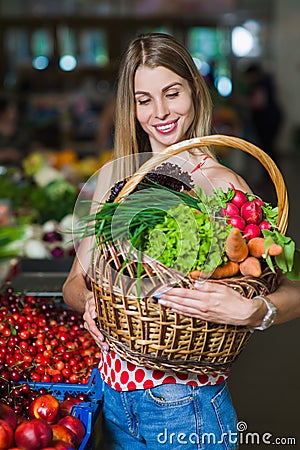 Portrait of a girl with a basket of vegetables Stock Photo