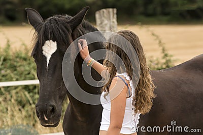 Young girl with her horse in a natural dressage exhibition in Lugo, Spain, june 2015 Editorial Stock Photo